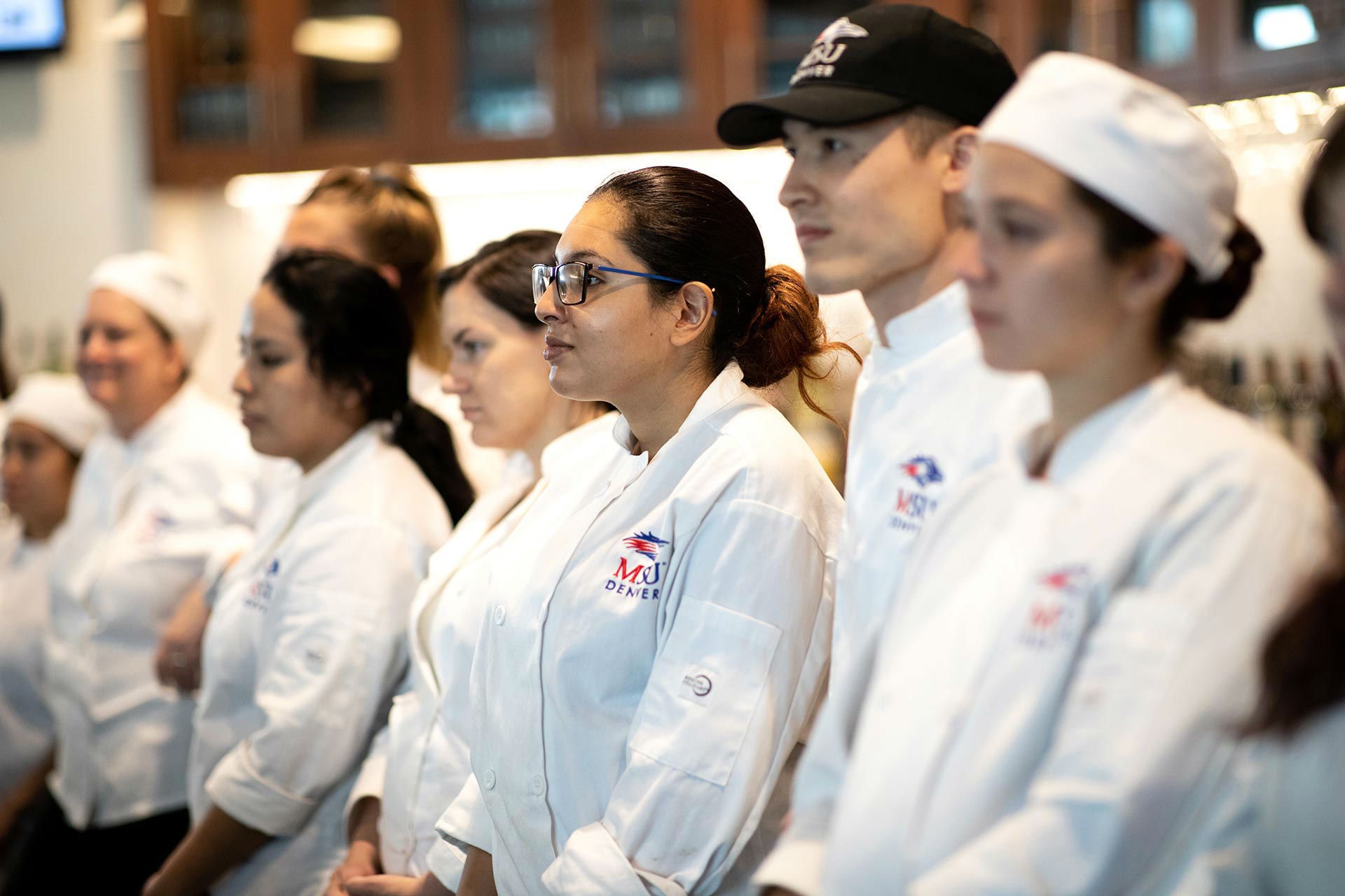 Students from MSU Denver’s school of Hospitality, Tourism and Events stand ready to serve a dining room of Denver restaurant and hospitality luminaries