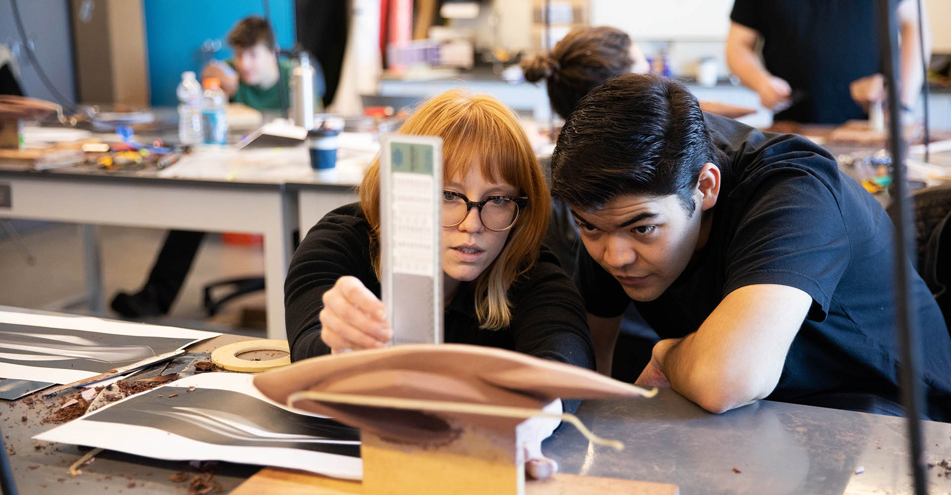 Two students build a model in an MSU Denver workshop