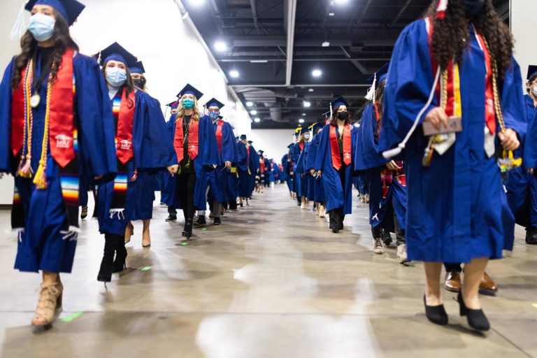 MSU Denver graduates walk at the commencement ceremony in December 2021