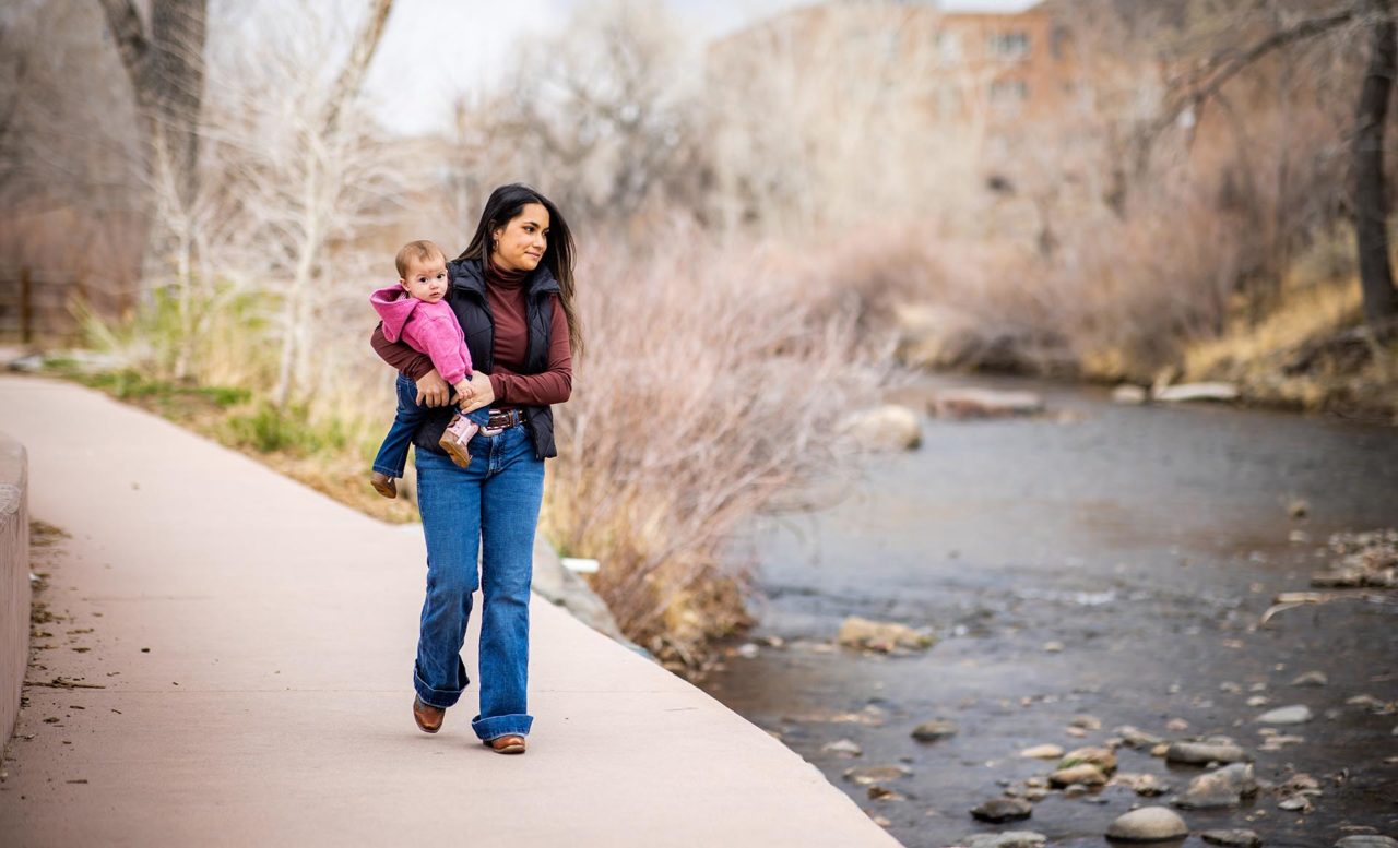 MSU Denver student Ayla Thompson walks outside in Golden with her baby daughter