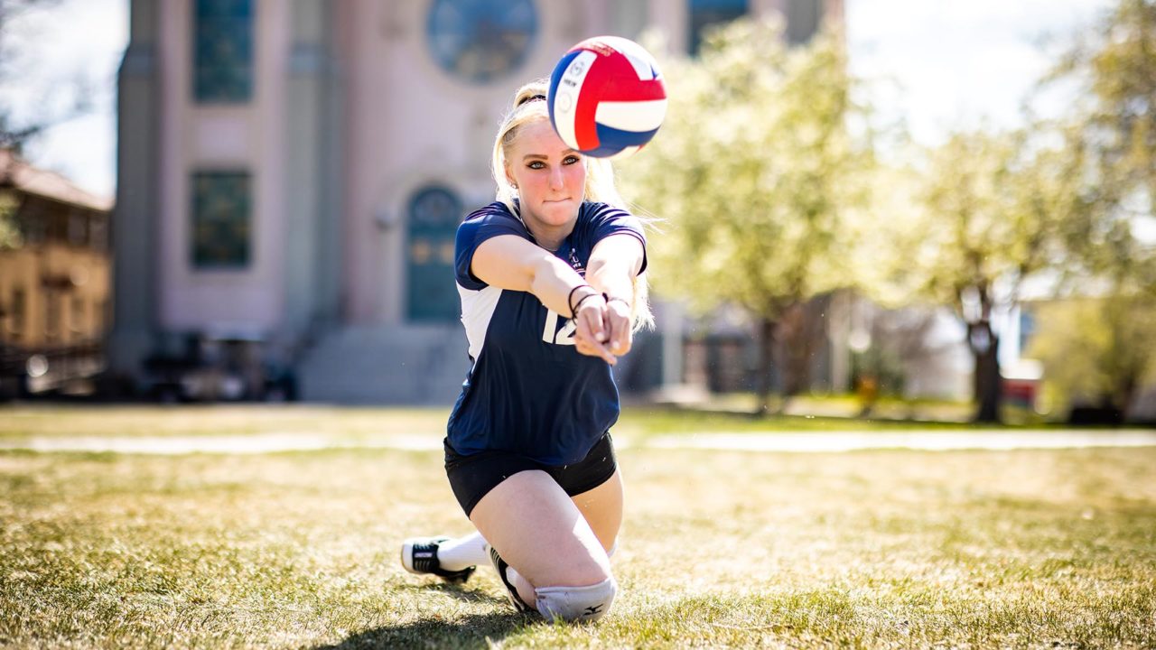 Anna Watson, 17, the youngest graduate for Spring 2022 Commencement, demonstrates how to pass the ball with a floor move on Auraria Campus.