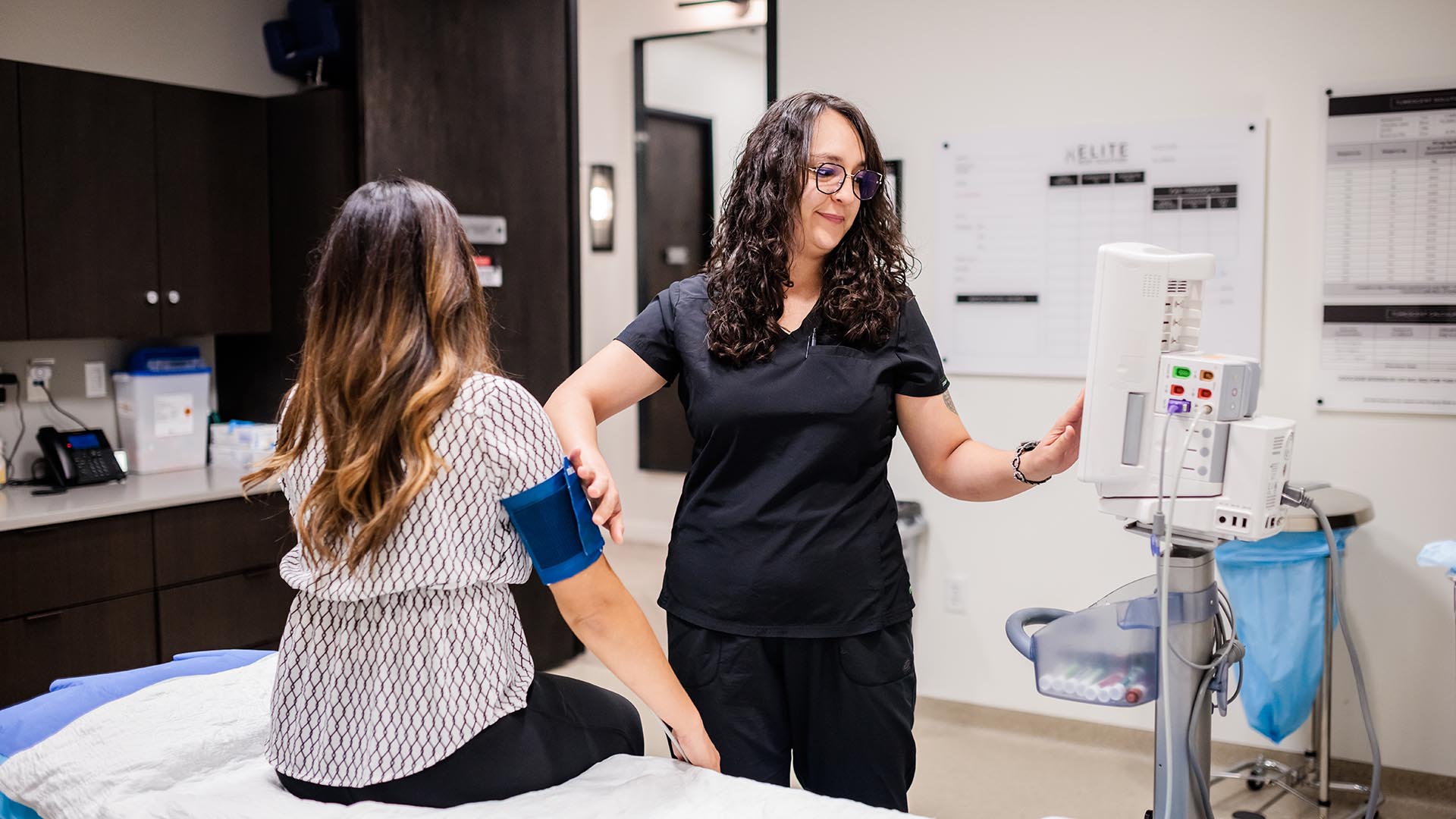 MSU Denver’s Alejandra Webster checks a patient’s vital signs at a private medical clinic in Denver.
