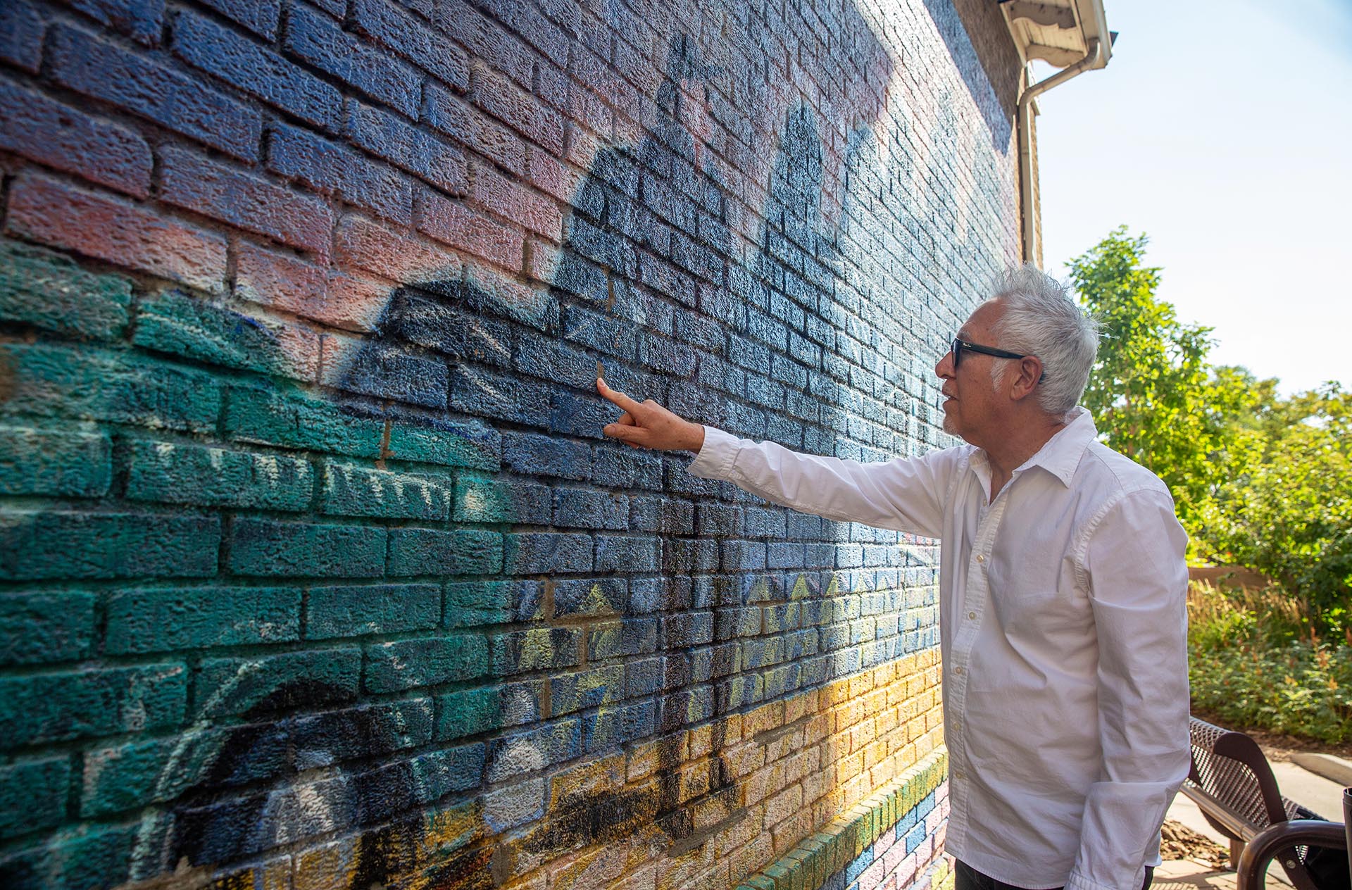 Carlos Frequez takes a first look at the mural after it was freshly painted.