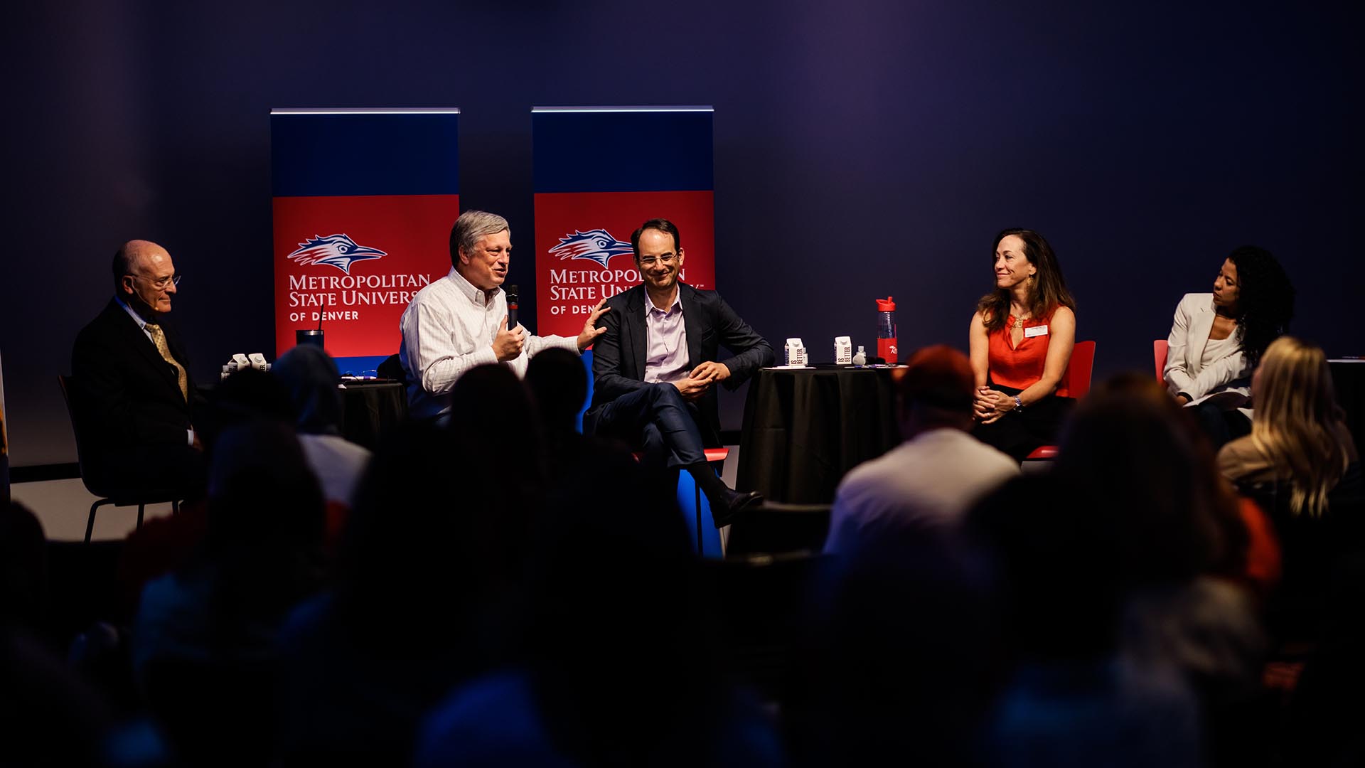 From left to right, MSU Denver General Counsel David Fine, former Colorado Secretary of State Wayne Williams (a Republican), Colorado Attorney General Phil Weiser (a Democrat), MSU Denver President Janine Davidson, Ph.D., and Professor and Chair of Communication Studies Katia Campbell, Ph.D., in a conversation titled Free Speech and the Art of Democracy.