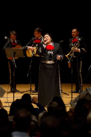 Alejandra Solis sings with Mariachi Los Correcaminos for the mariachi festival at the King Center