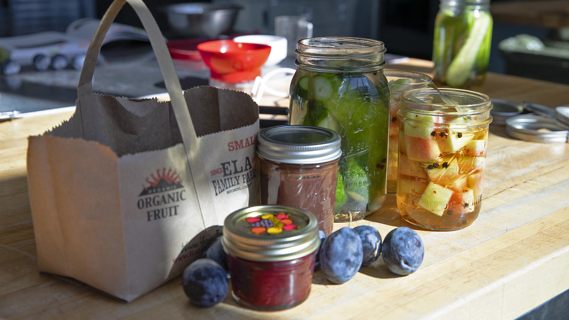 Jars of jam, pickles and watermelon rinds