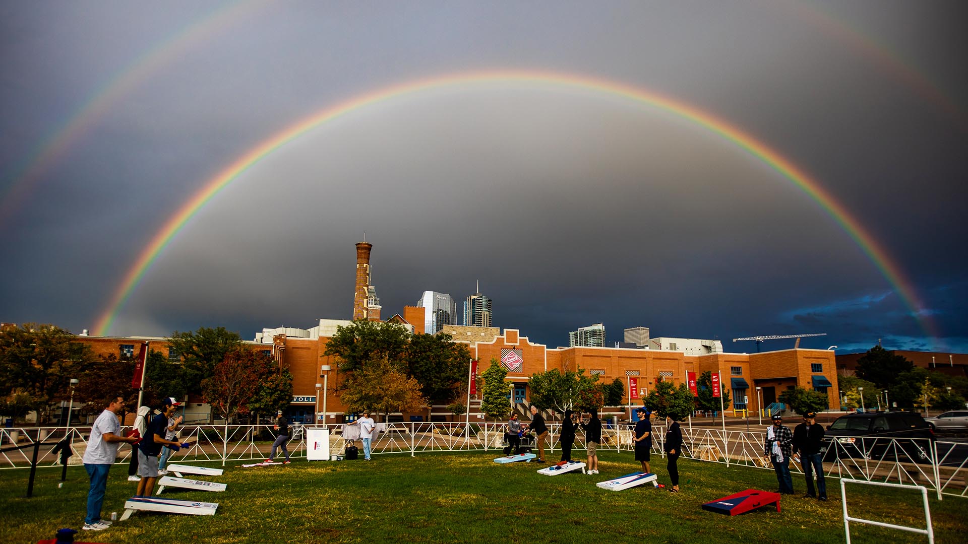 A double rainbow appears over the Homecoming event.