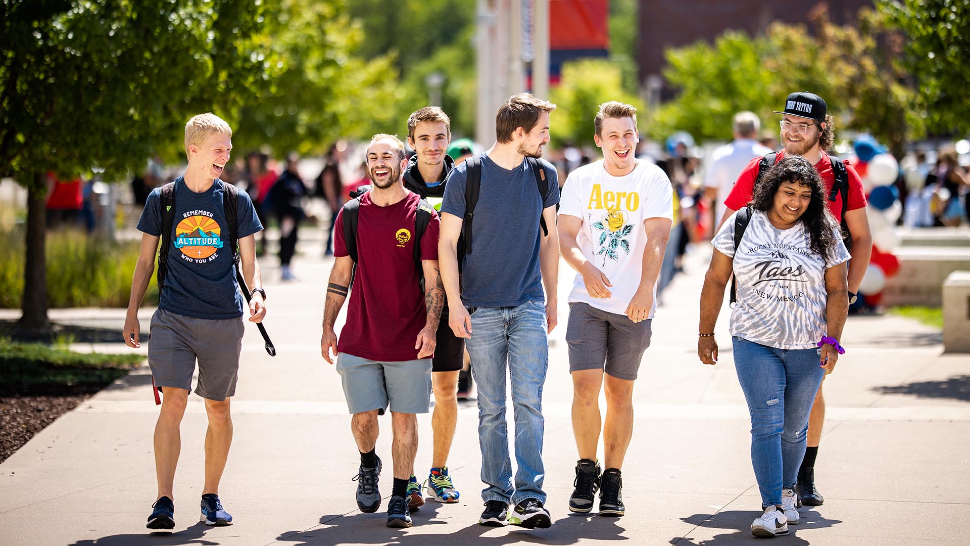 Students on campus smiling