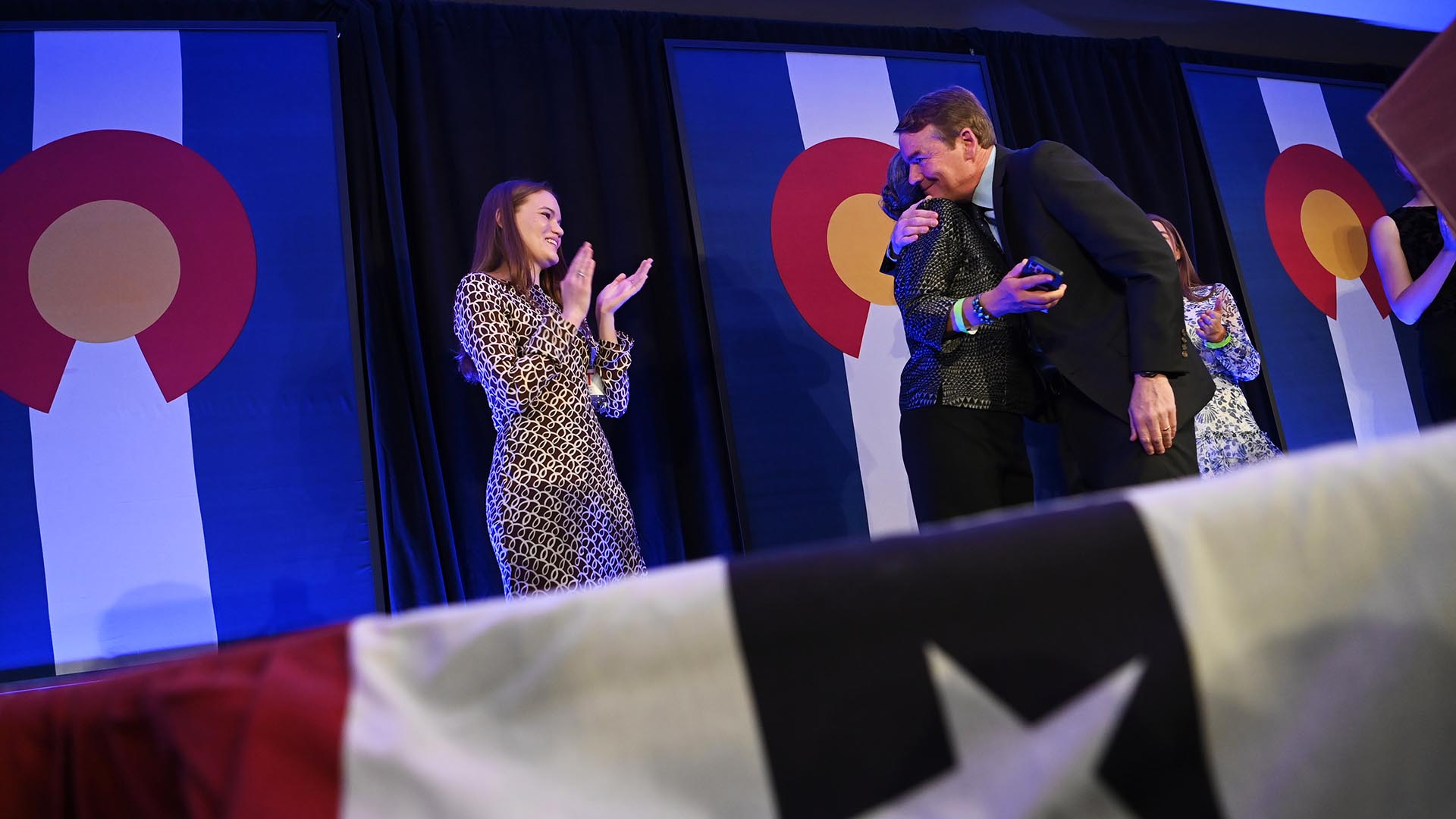 Senator Michael Bennet embraces his family