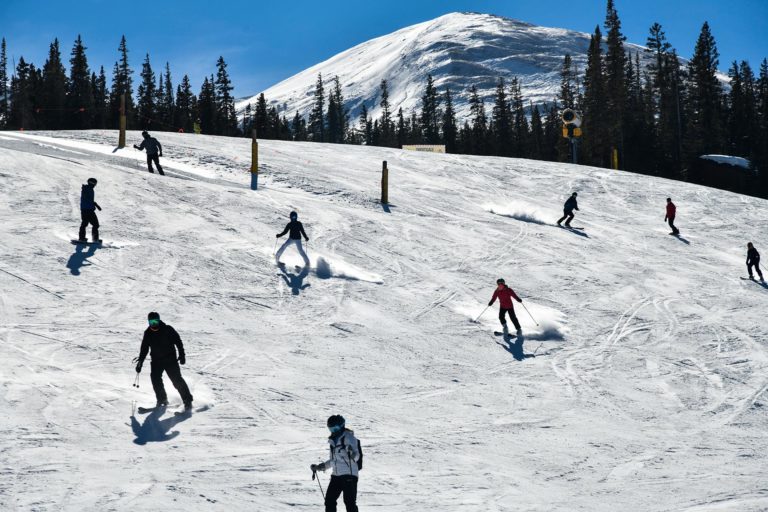 People skiing and snowboarding
