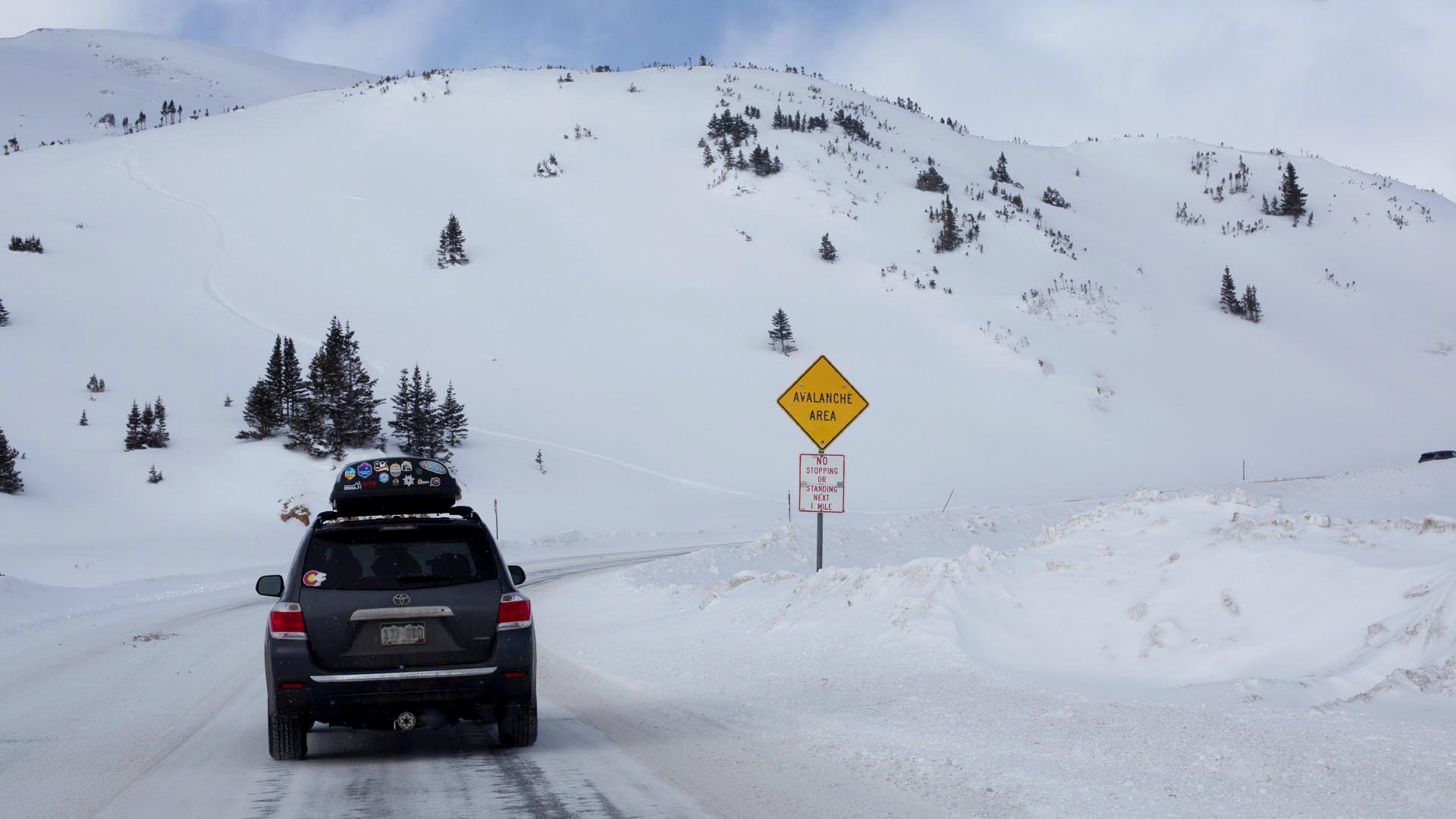 A car drives over Loveland Pass
