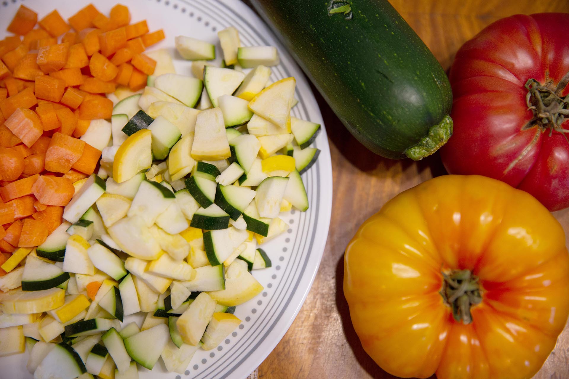 A photo of tomatoes and zucchini