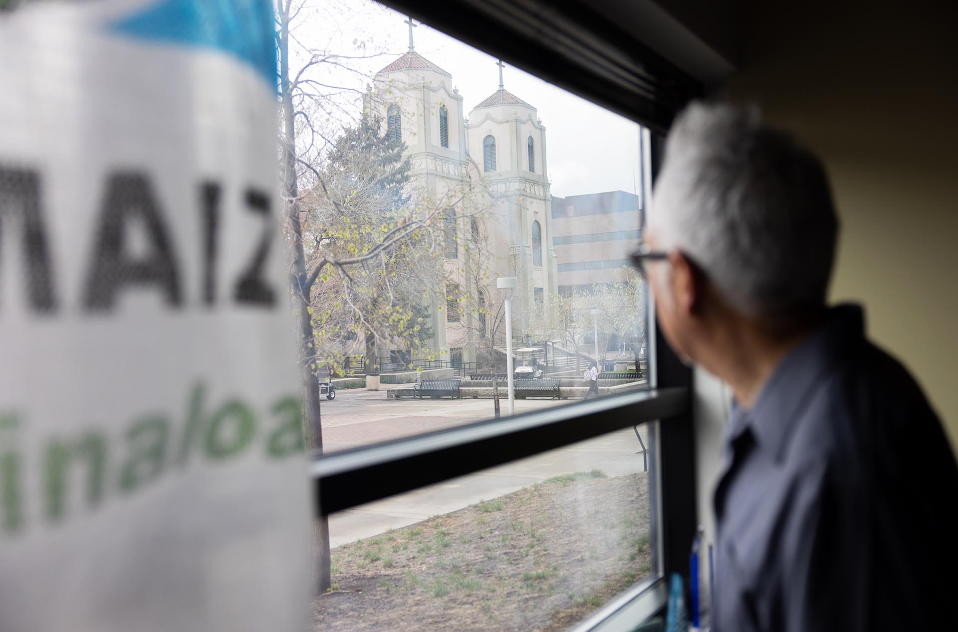 MSU Denver art professor and alum Carlos Fresquez looks at St. Cajetan's out of his office window.