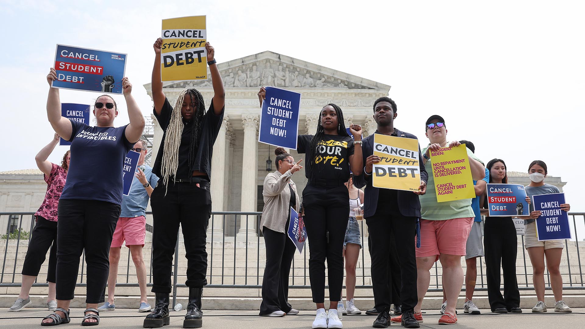 Student debt relief activists participate in a rally at the U.S. Supreme Court