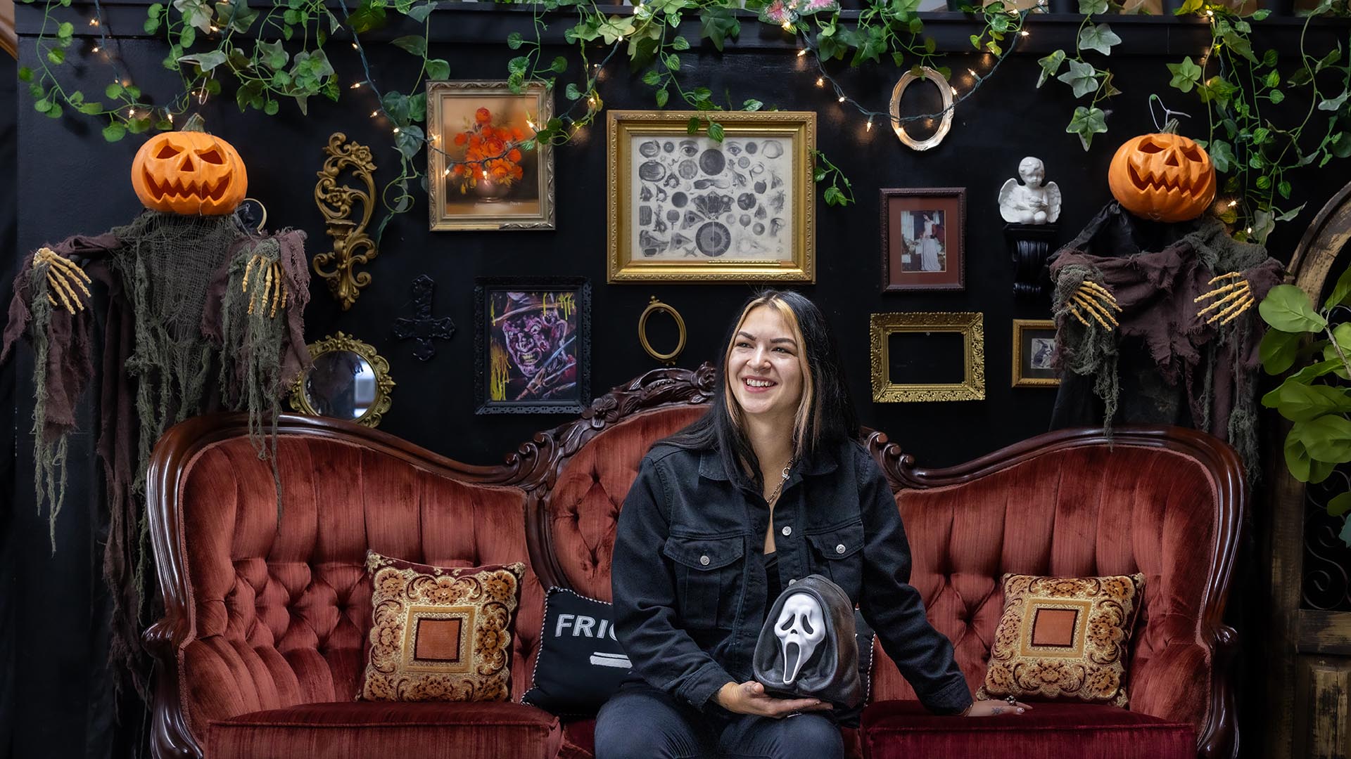 Emerald Boes, owner of HORRID mag and the shop, seats at her community space.