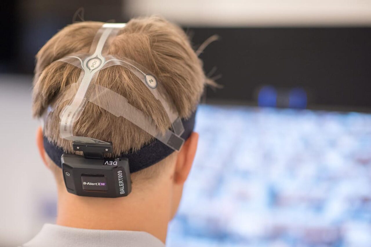 A student is fitted with electroencephalogram and galvanic skin response technology to track biometric responses