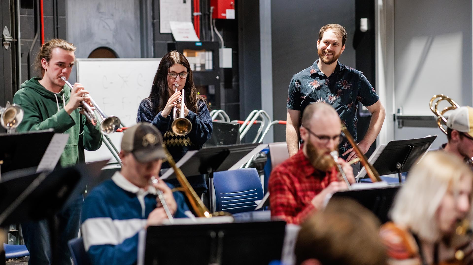 Jonathan Zimny, CCJA program assistant, right, supports students at “Big Band Fridays,” a multi-school jazz-ensemble workshop at the MSU Denver School of Music Kalamath Building