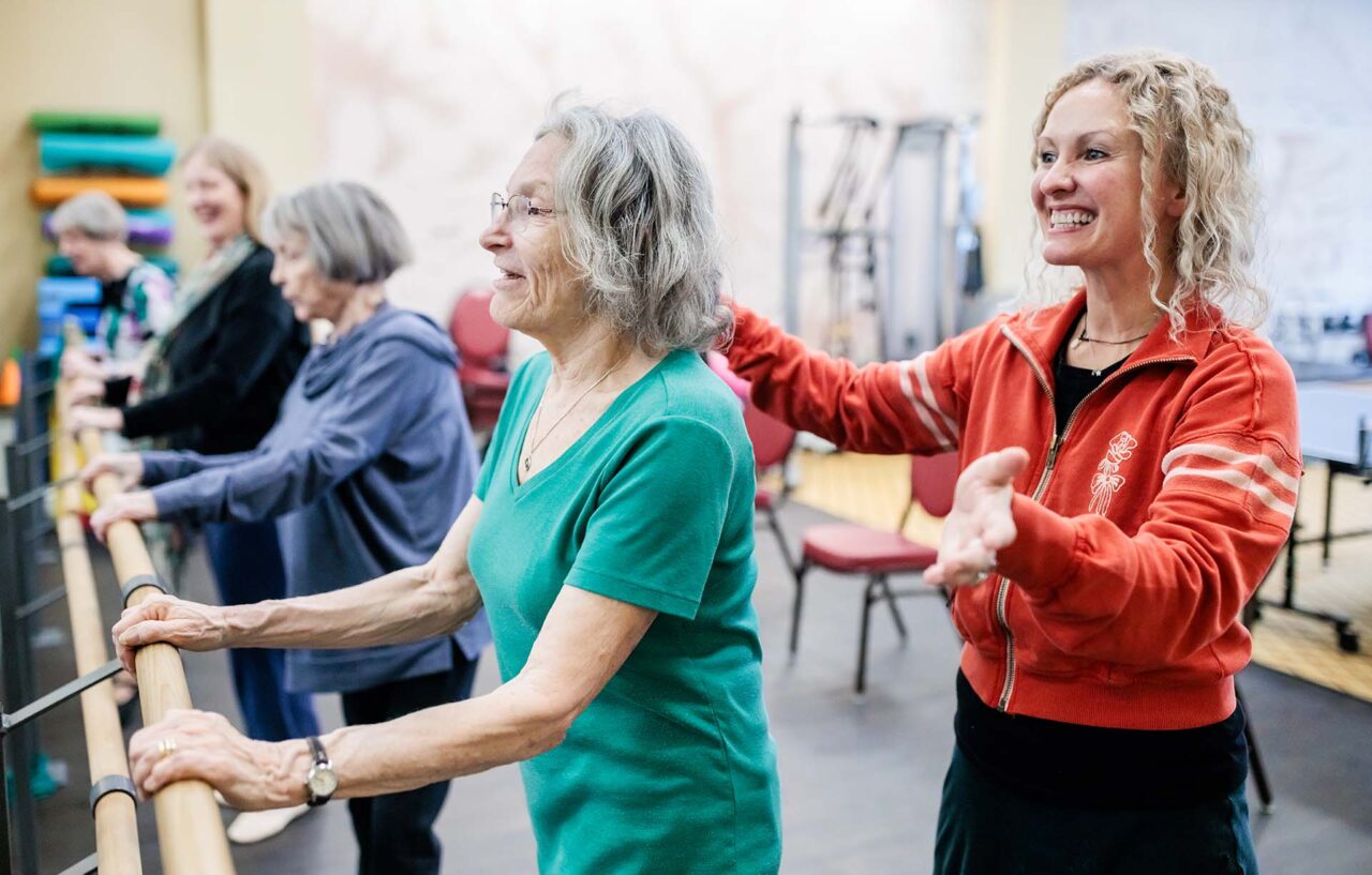 Nicole Predki, Ph.D, supports Judy Stiber and others at a dance class at Balfour Senior Living