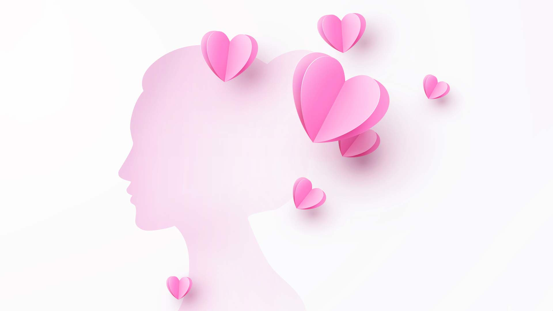 Illustration of silhouette profile of woman and pink hearts