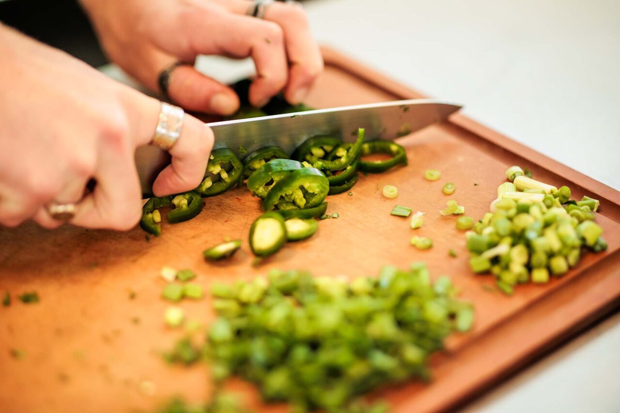 MSU Denver student Luke Mantych prepares ingredients for vegan queso dip