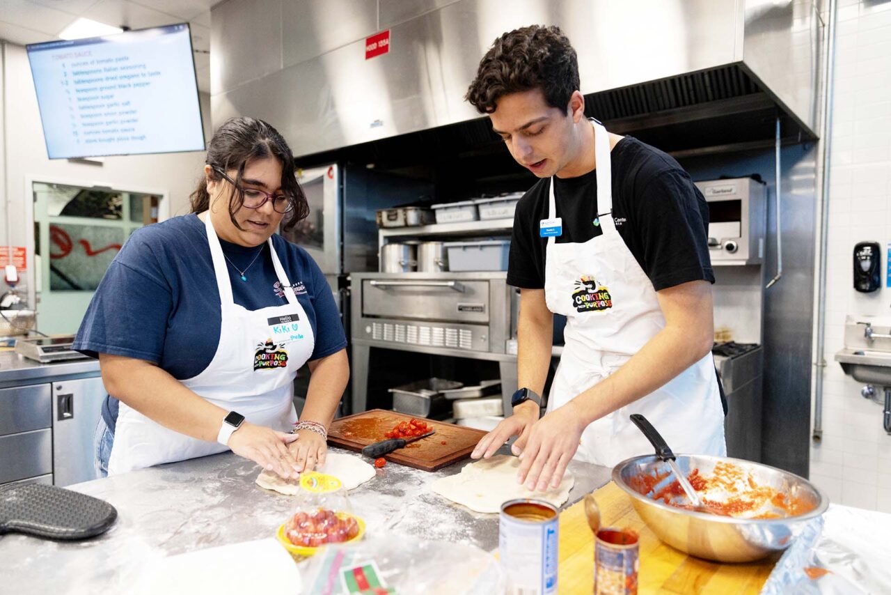 MSU Denver students Kiki Garcia and Dominic Spina roll out their pizza dough