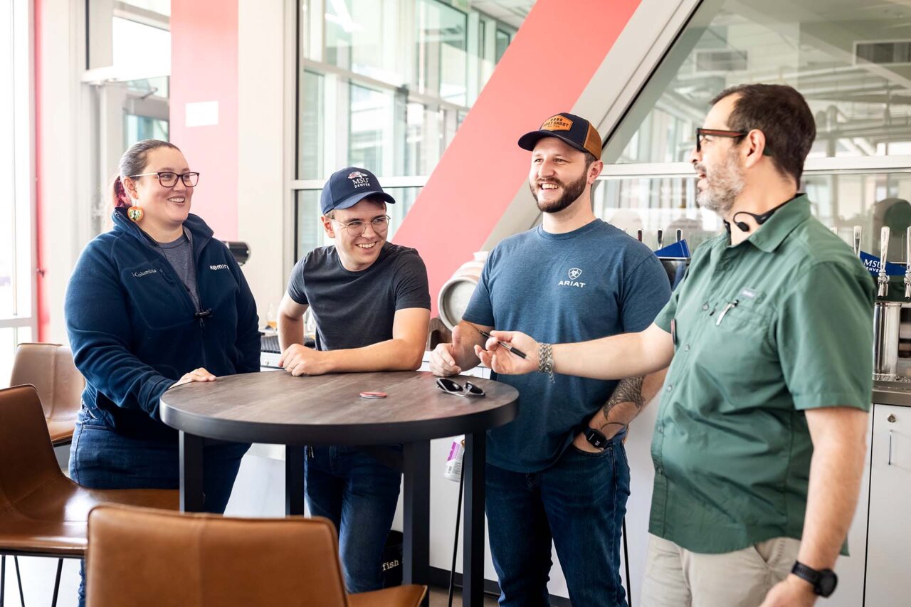 MSU Denver’s Elliot Knight, second to left with classmates, and Lecturer and Brewery Operations Program coordinator Bernardo Alatorre, right, in the Brewing Science and Technology class