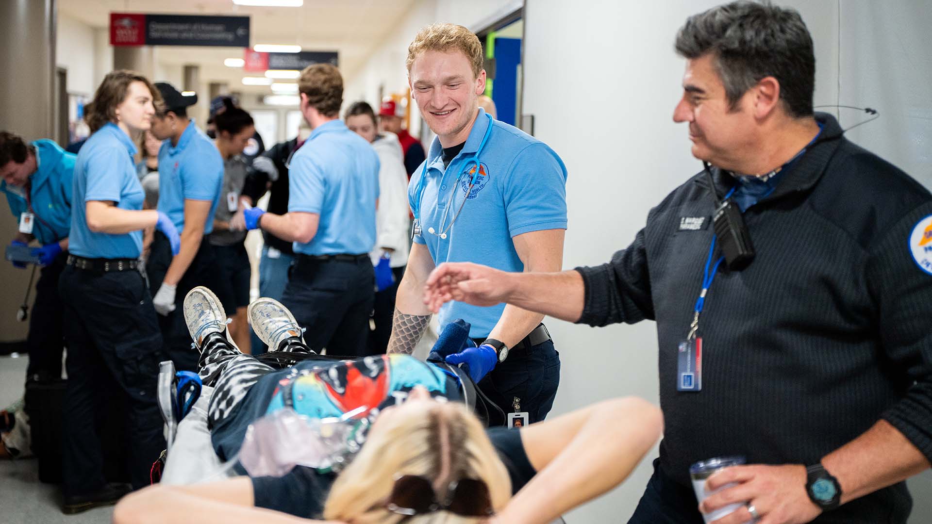 Denver Paramedic students retrieve and care for patient actors during the simulation event