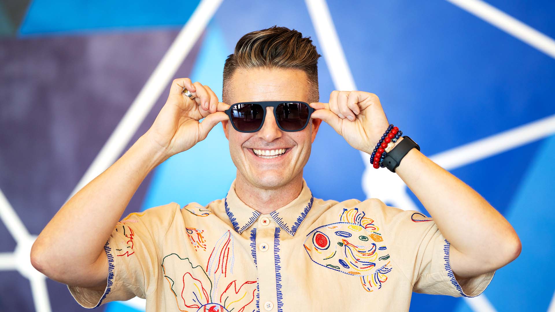 Stephen Lease, founder of sunglasses company goodr, poses with a pair of his company's shades.