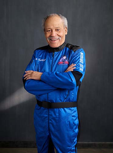 A portrait of Ed Dwight in his Blue Origin uniform.