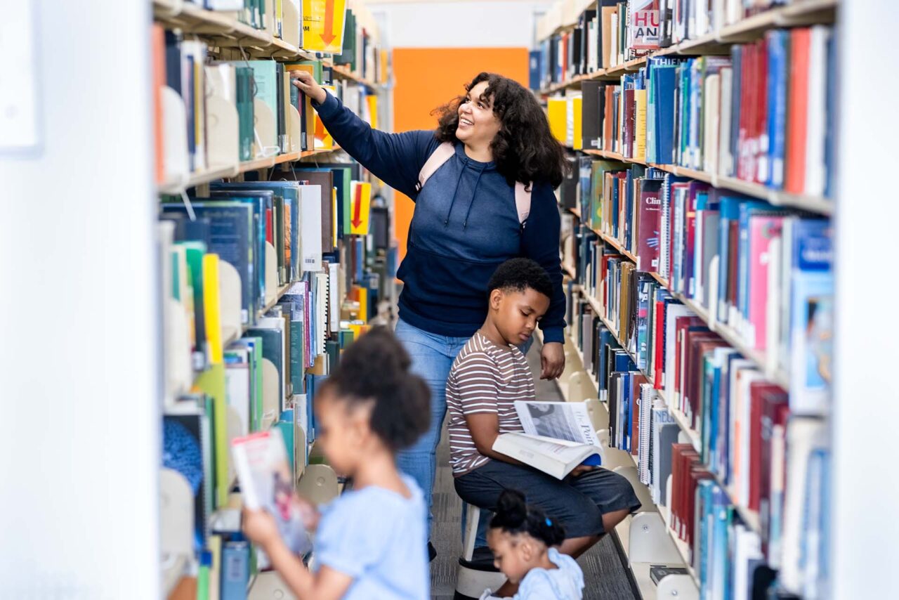 Mariyah Younger and her children in the library