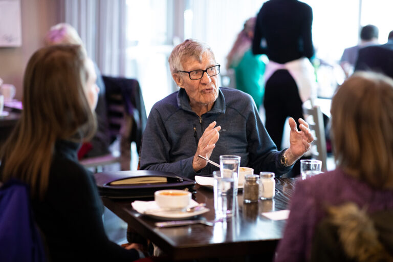Frank Day talks with fellow guests during a student-prepared luncheon at the MSU Denver School of Hospitality