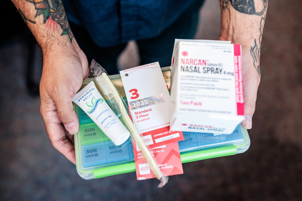 MSU Denver Master of Social Work student Matthew Bustos holds supplies that are given to patients in need.