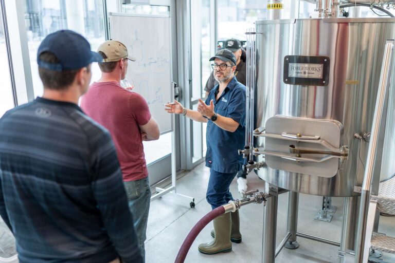 Professor Bernardo Alatorre demonstrates to brewing students.