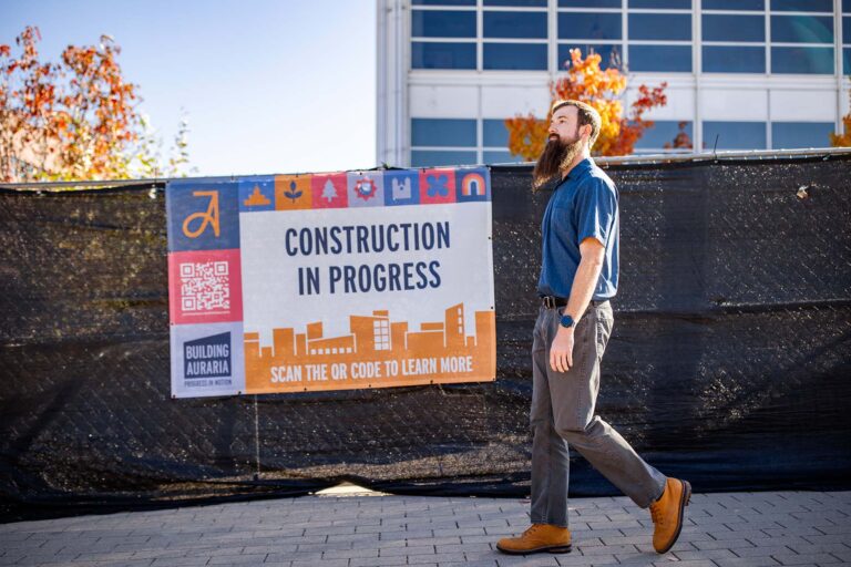MSU Denver student Matt Molloy walks past construction on campus.