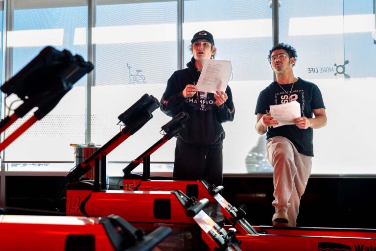 MSU Denver students Conner Stinnett, left, and Brandon Jones analyze rowers.