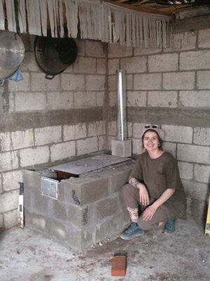 An MSU Denver student and a smokeless stove.