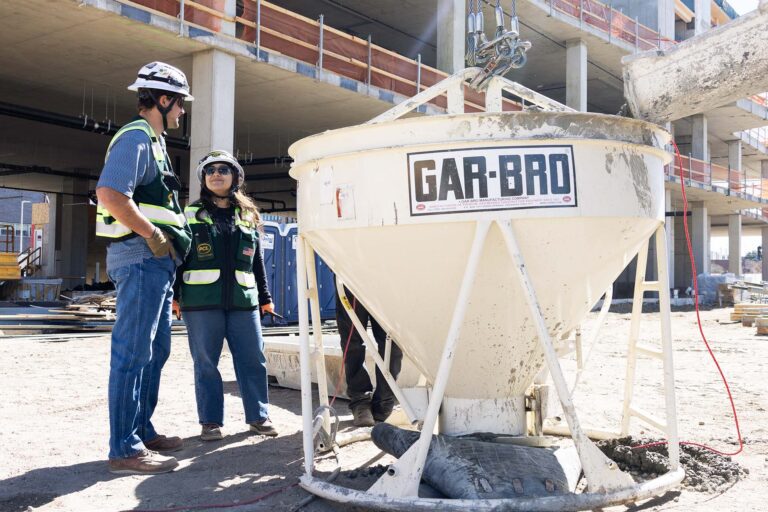 MSU Denver Civil Engineering Technology student and PCL intern Claudia Carrillo on the site of Summit House with MSU Denver alum and PCL Senior Project Engineer Owen Reynolds.