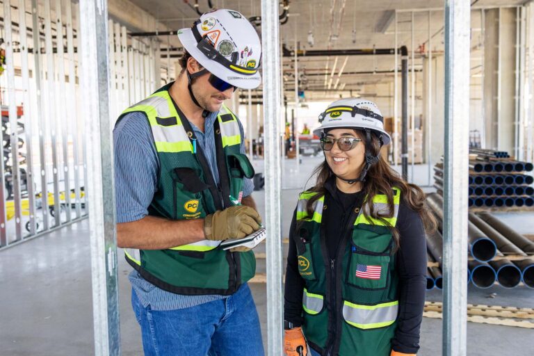 MSU Denver Civil Engineering Technology student and PCL intern Claudia Carrillo on the site of Summit House with MSU Denver alum and PCL Senior Project Engineer Owen Reynolds
