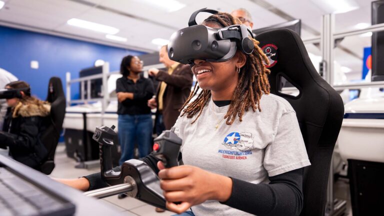 Emma Oliver flies a simulated aircraft in virtual reality