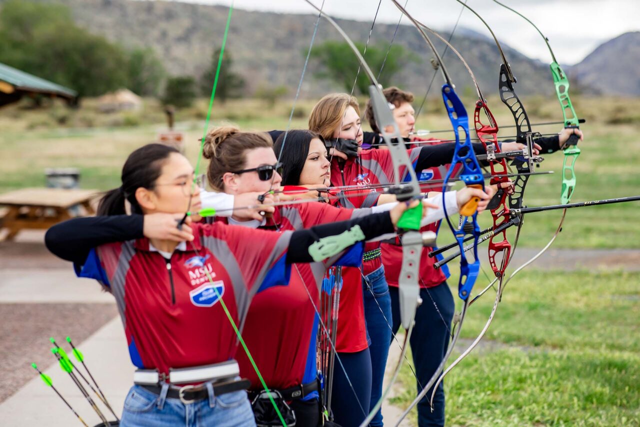 Members of the Metropolitan State University of Denver Archery Club gather during practice at Bear Creek Lake Park