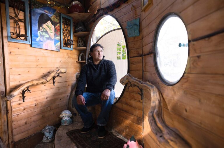 Rudi Monterroso inside the hobbit house he designed and built.