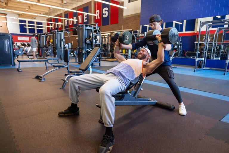 Auston Duncan works out with MSU Denver trainer Zavon Kraske at the campus gym.