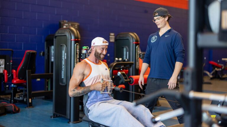 Air Force Veteran Auston Duncan works out with MSU Denver trainer Zavon Kraske at the Auraria Event Center gym on June 12, 2026.