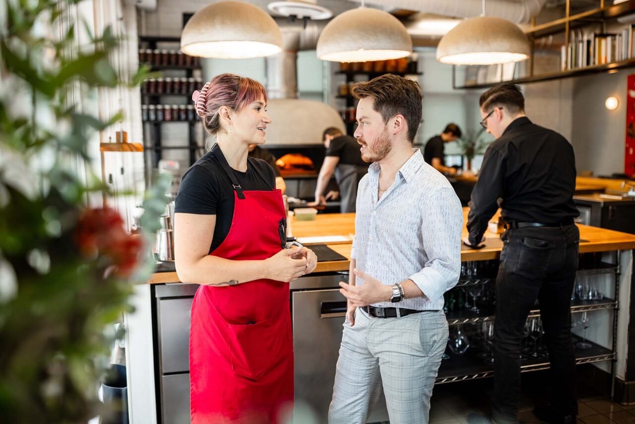 Nicolas Escobedo chats with bar manager Autumn Devine